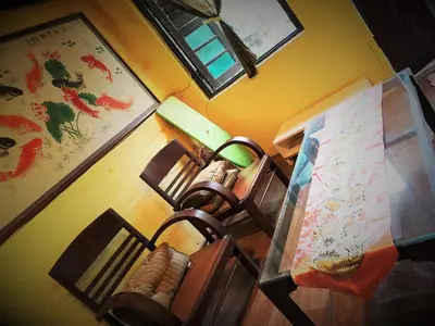 a room with two chairs and a table with a map at MoonTree47 in George Town