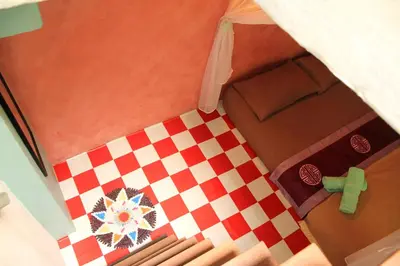 an overhead view of a room with a checkered floor at MoonTree47 in George Town