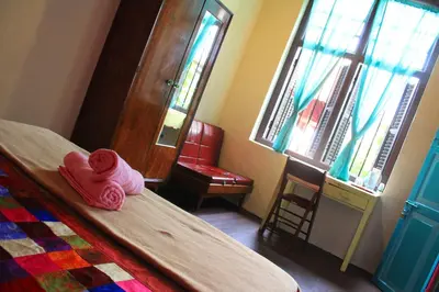 a room with a bed with a stuffed animal on it at MoonTree47 in George Town