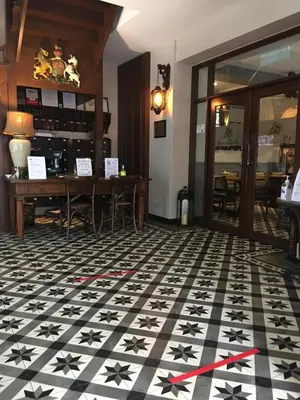 a room with a black and white floor with stars on it at Campbell House in George Town