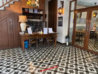 a room with a table with stars on the floor at Campbell House in George Town