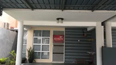 a black garage door with a sign on it at Miker Homestay in Seri Iskandar
