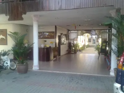 a lobby with potted plants in a building at Pangkor Bay View Beach Resort in Pangkor