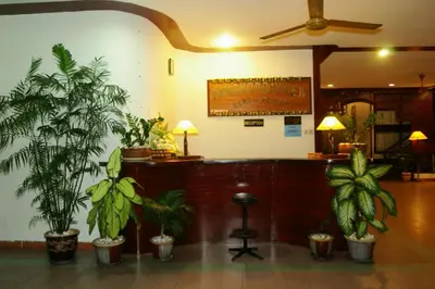 a lobby with a bunch of potted plants at Pangkor Bay View Beach Resort in Pangkor
