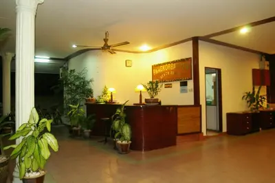 a lobby with a reception desk and potted plants at Pangkor Bay View Beach Resort in Pangkor