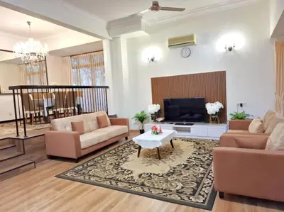 a living room with two couches and a tv at 5-BEDROOM FERRINGHI HOUSE with WIFI , NETFLIX , BBQ SET , 5 MINUTES WALK to BEACH in Batu Ferringhi