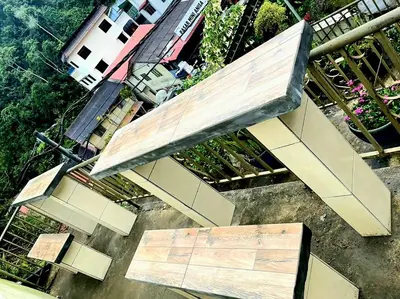 a bench sitting on top of a building at Sakura Guest House in Cameron Highlands