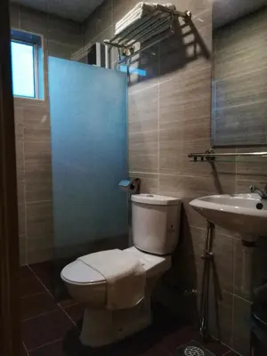 a bathroom with a toilet and a sink at Kampar Boutique Hotel (Kampar Sentral) in Kampar