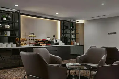 a waiting room with chairs and a counter at AC Hotel by Marriott Ipoh in Ipoh