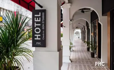 a sign on the side of a building at Hutton Suite Hotel Managed by The Ascott Limited in George Town