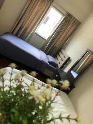 a small room with a bed and a window at D’House in Ipoh
