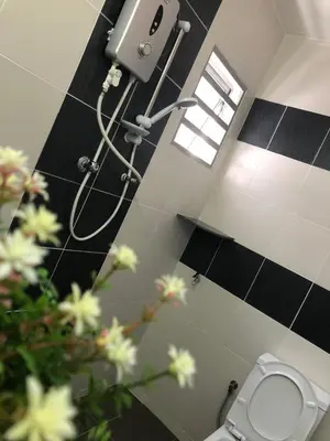 a bathroom with a shower and a toilet in a room at D’House in Ipoh