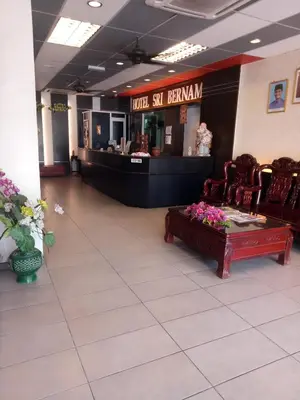 a lobby of a hotel with a hotel sitenian counter at Hotel Sri Bernam in Sabak Bernam