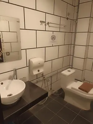 a bathroom with a toilet and a sink at M Season Boutique Hotel Sdn Bhd in Sungai Petani