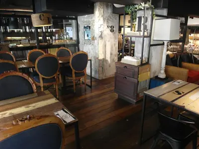 a room with chairs and tables in a store at French Hotel in Ipoh