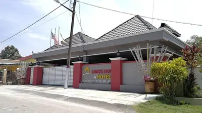 a fast food restaurant on the side of a street at Weng Kong Homestay in Slim River