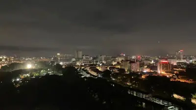 a night view of a city with lights at K. Riverfront apartment in Ipoh