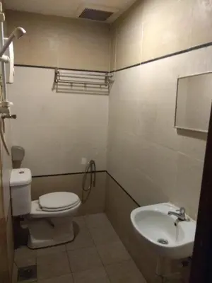 a bathroom with a toilet and a sink at Starview Hotel in Lumut