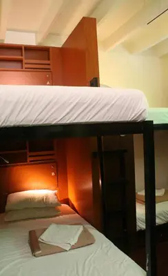 a couple of bunk beds in a room at Red Inn Court in George Town