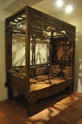 an old wooden cabinet with glass doors in a room at Red Inn Court in George Town