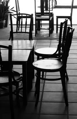 a table and chairs and a table and a table and chairs at Red Inn Court in George Town