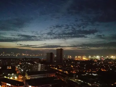 a view of a city at night at HomeSweetHome in Perai