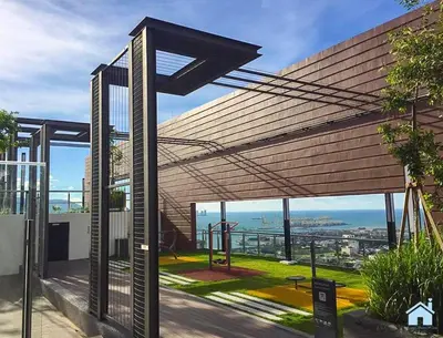 awning over a building with a view of the ocean at HomeSweetHome in Perai
