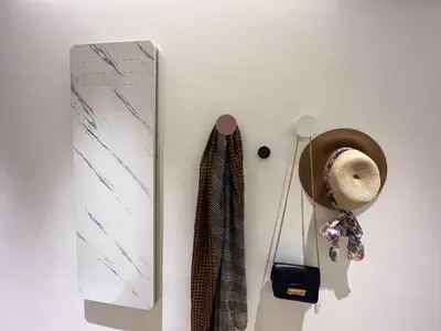 a hat and ties hanging on a wall at Apple 1 Hotel Queensbay in Bayan Lepas