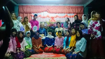 a group of people posing for a picture at Homestay Zulaika Kota Aur in Kepala Batas