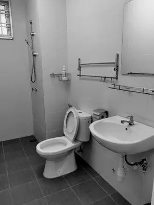 a bathroom with a toilet and a sink at Mr.J Homestay in Taiping