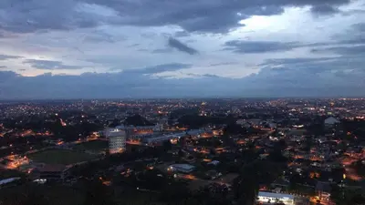 an aerial view of a city at night at Mr.J Homestay in Taiping
