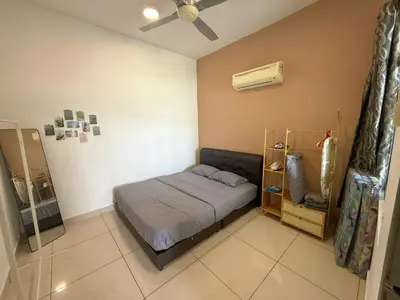 a small bedroom with a bed and a fan at Taiping Centre Point Suite 7 by BWC in Taiping