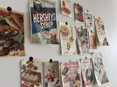 a wall with magazines and posters on it at Taiping Centre Point Suite 9 by BWC in Taiping