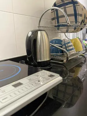 a toaster sitting on top of a kitchen counter at Taiping Centre Point Suite 10 by BWC in Taiping