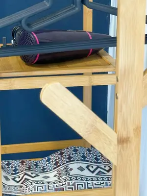 a wooden shelf with a brush and other items on it at Taiping Centre Point Suite 10 by BWC in Taiping