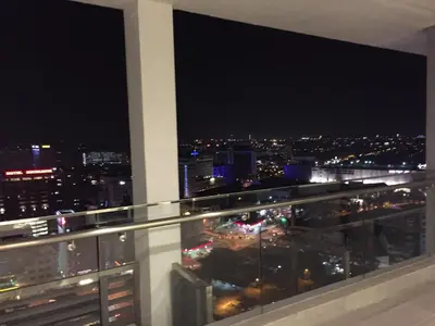 a view of a city at night from a balcony at PM Octagon Ipoh Duplex Suite (4-12paxs) in Ipoh