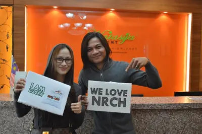 two people holding signs that say we love imperialism at Zarania Hillhomes Cameron Highlands in Cameron Highlands