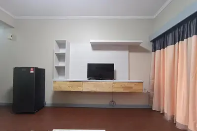 a room with a flat screen tv on a wall at Zarania Hillhomes Cameron Highlands in Cameron Highlands