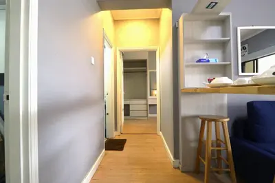 a hallway leading into a kitchen with a blue couch at Zarania Hillhomes Cameron Highlands in Cameron Highlands