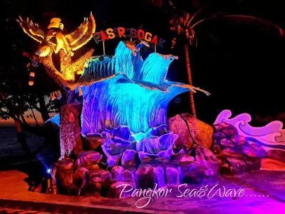 a ice sculpture of a dragon and a waterfall at Sea & Wave #1 Coral Bay Apartment in Pangkor