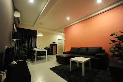 a living room with a couch and a table at The Osborne Apartments in Ipoh