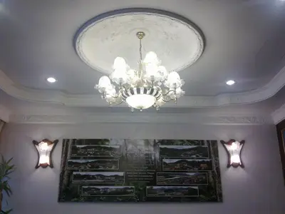 a chandelier hanging from a ceiling in a room at Hotel Remix in Cameron Highlands