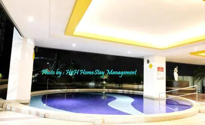a large swimming pool in the middle of a building at H2H - Ohayō Ipoh Majestic Ipoh in Ipoh