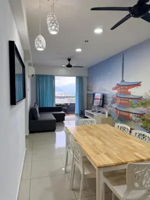 a living room with a dining room table with chairs at H2H - Ohayō Ipoh Majestic Ipoh in Ipoh