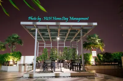 a group of tables and chairs in front of a building at H2H - Ohayō Ipoh Majestic Ipoh in Ipoh