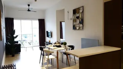 a kitchen and living room with a table and chairs at Misty Wonderland Cameron Next to Night Market 9 PAX in Cameron Highlands