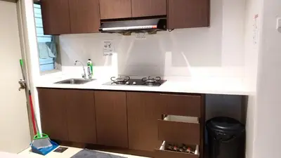 a kitchen with a sink and a stove at Misty Wonderland Cameron Next to Night Market 9 PAX in Cameron Highlands
