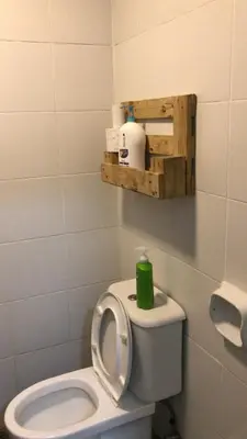 a bathroom with a toilet with a green candle on it at Vin-Cottage Cameron Golden Hills (Next to Night Market) in Cameron Highlands