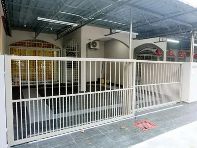 a white fence in front of a building at Taiping Cozy Homestay II in Taiping