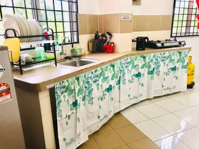 a kitchen with a sink and a counter top at Homestay Lestary near Taiping Fast WIFI Netflix in Taiping